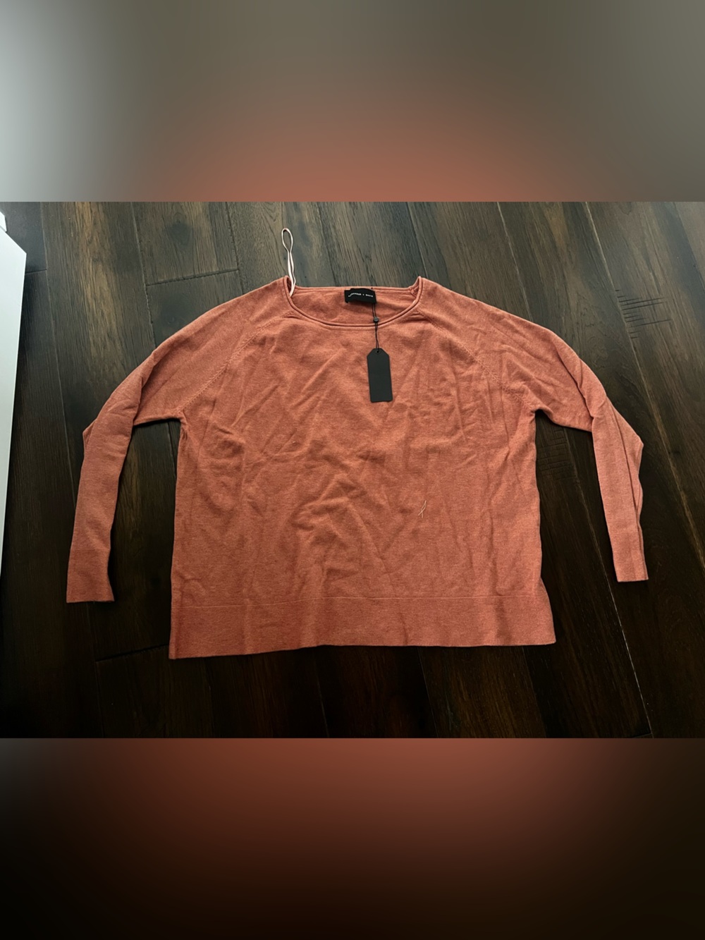 Loose fit soft pullover sweater with raw edge neckline in spice